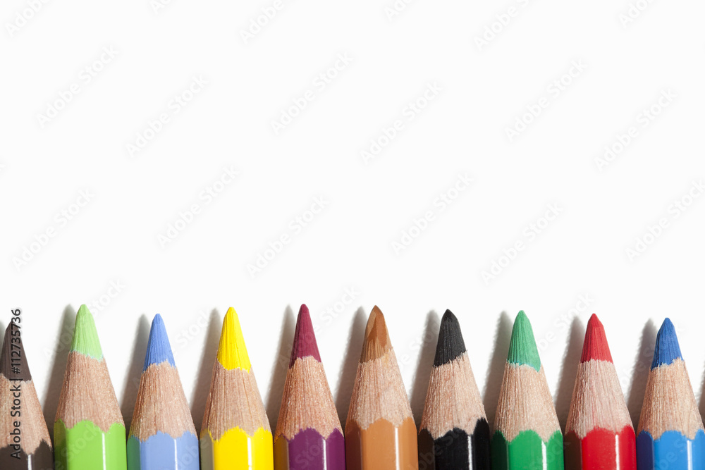 Colored pencils on white background. Colored pencils on white background.