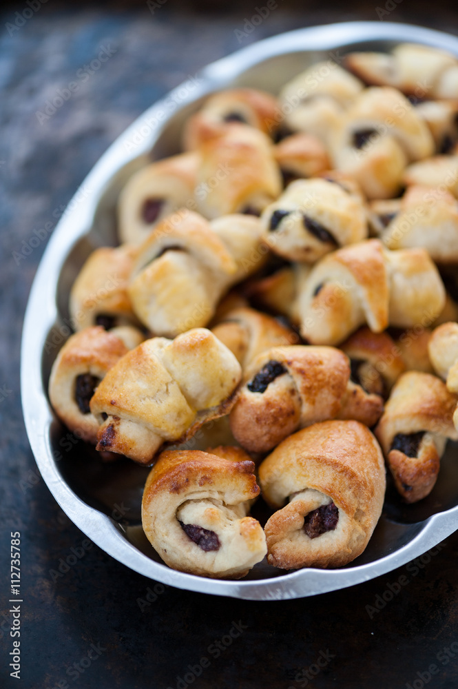 Small croissants on a metal tray