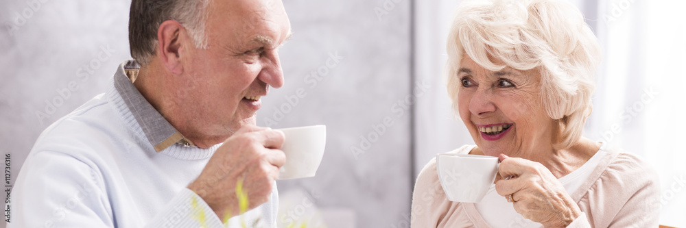 Fototapeta premium Cheerful couple and coffee