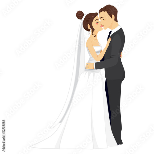 Beautiful young couple tenderly kissing together on their wedding day