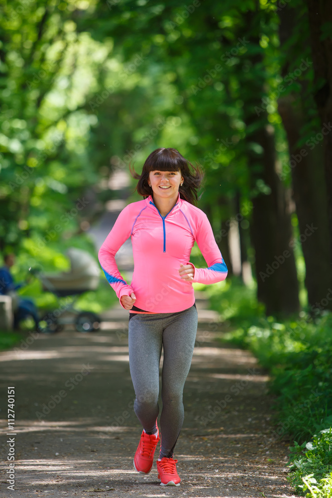 young fitness woman running at forest trail young fitness woman running at forest trail