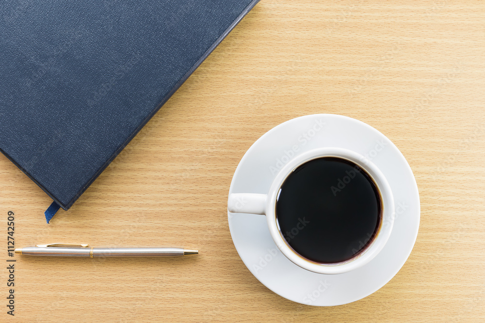 Coffee cup and notebook Coffee cup and notebook
