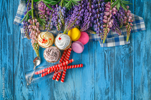 Summer morning breakfast in garden with flowers on table photo