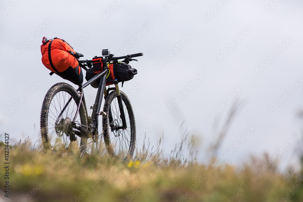 Obraz premium Bicycle with orange bags for travel