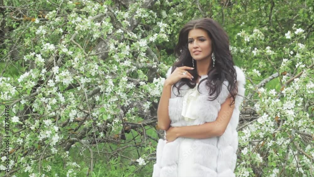 A beautiful dark-skinned woman in a white dress A beautiful dark-skinned woman in a white dress