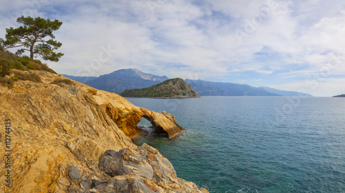 Turkey, Oludeniz. Sea, pines and the sea. Rocky Golden color