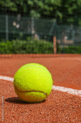 Tennis equipment on clay court