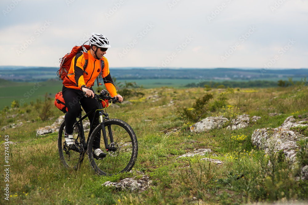 Fototapeta premium Young man is riding bicycle outside. Healthy Lifestyle.
