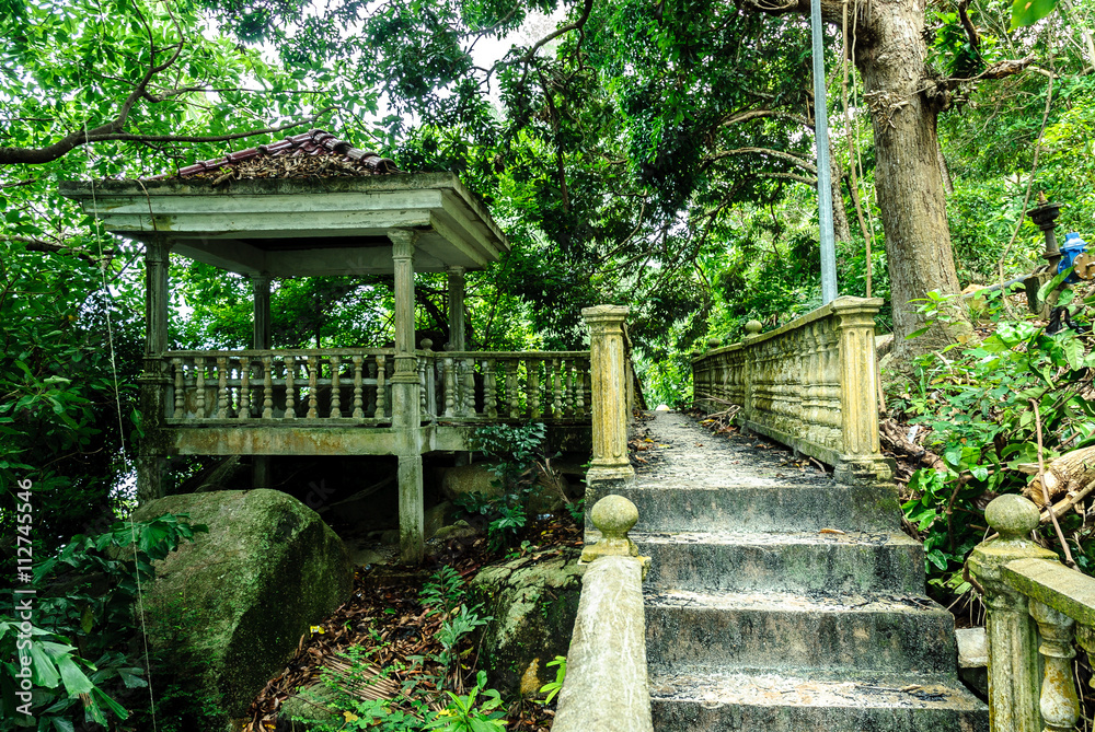 stone walk in ruins in the island of Besar in Perhentian Island in Malaysia stone walk in ruins in the island of Besar in Perhentian Island in Malaysia