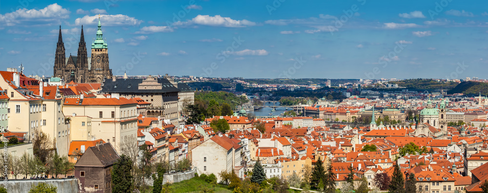 Prague, Czech Republic panorama. St. Vitus Cathedral over old town red roofs.