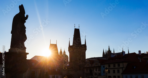 Charles Bridge at sunrise, Prague, Czech Republic. Statues and towers silhouettes