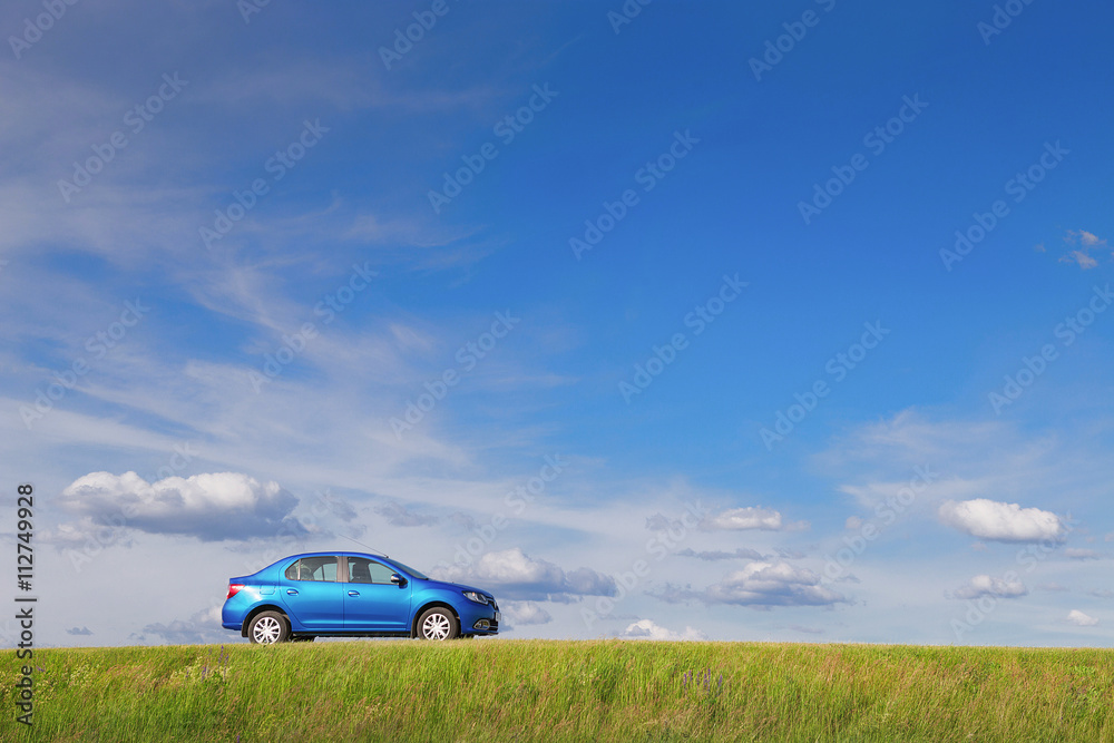Fototapeta premium New car parked by the side of a lonely road in rural