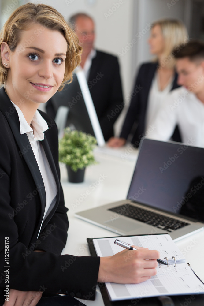 Portrait of a businesswoman using laptop in office Portrait of a businesswoman using laptop in office