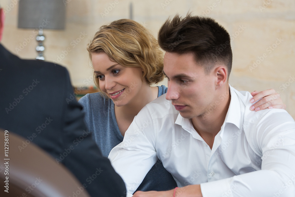 couple signing loan contract couple signing loan contract