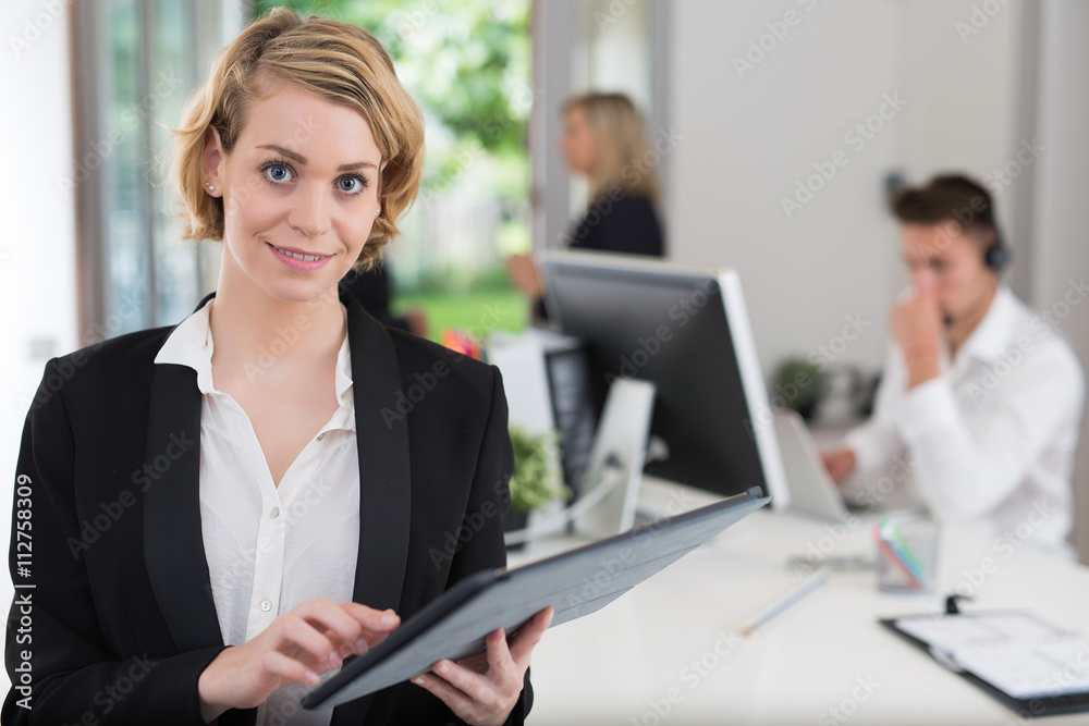 business woman with her staff, people group in background at office business woman with her staff, people group in background at office