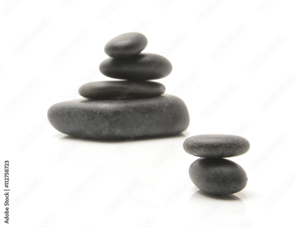 Heap of spa hot stones isolated on white