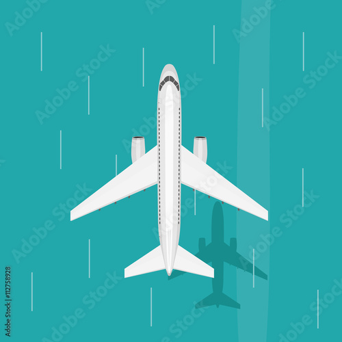 Airplane flies in the sky over sea. View from above