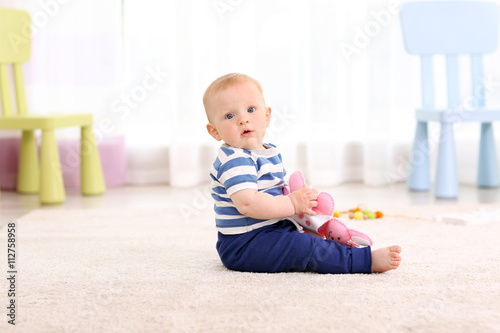 Adorable baby with pink bea...