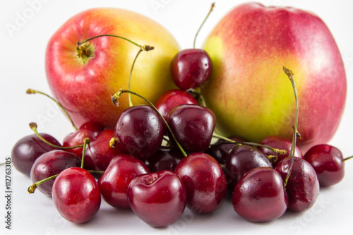 Red fresh cherries and apples