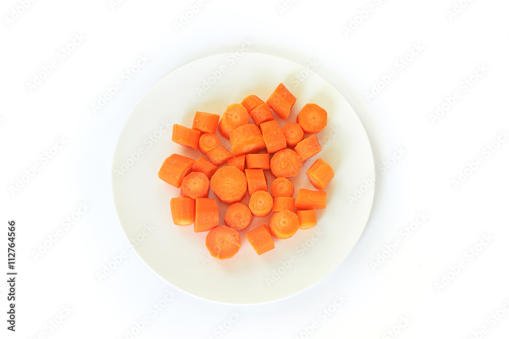 Fresh carrot on a white plate isolated on white background