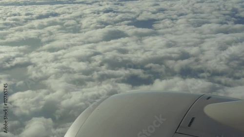 traveling by air. View through airplane window. Flight abobe spectacluar clouds. 4k photo