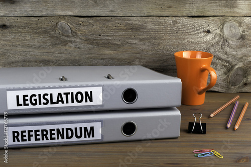 Legislation and Referendum - two folders on wooden office desk