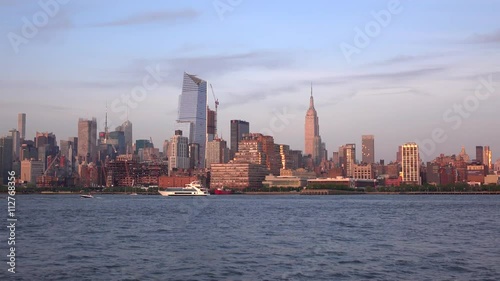 Luxury yacht on Hudson river. New York city skyline at sunset time. Manhattan New York City photo