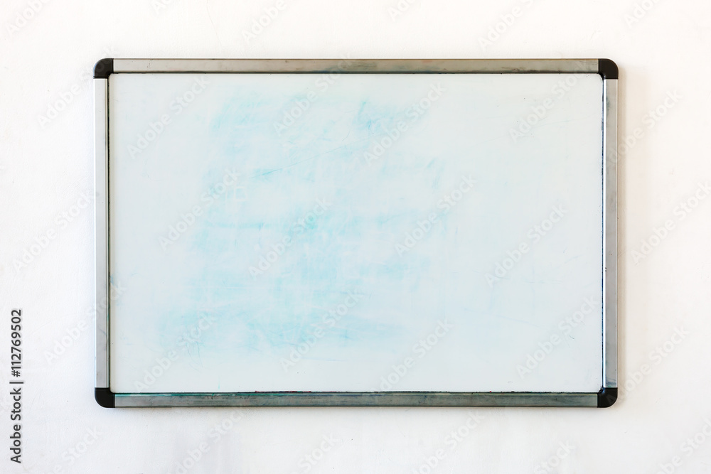 Old whiteboard for office with traces of stains and spots. Writing board  hanging on the old dirty wall in the office. Stock-Foto | Adobe Stock