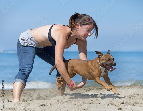 Photography dogs  jumping on beach