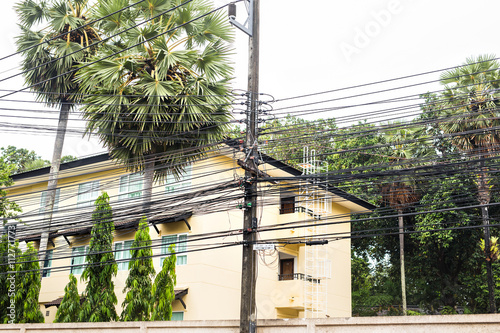 Messy electrical cables in thailand - Uncovered optical fiber technology open air outdoors asian cities