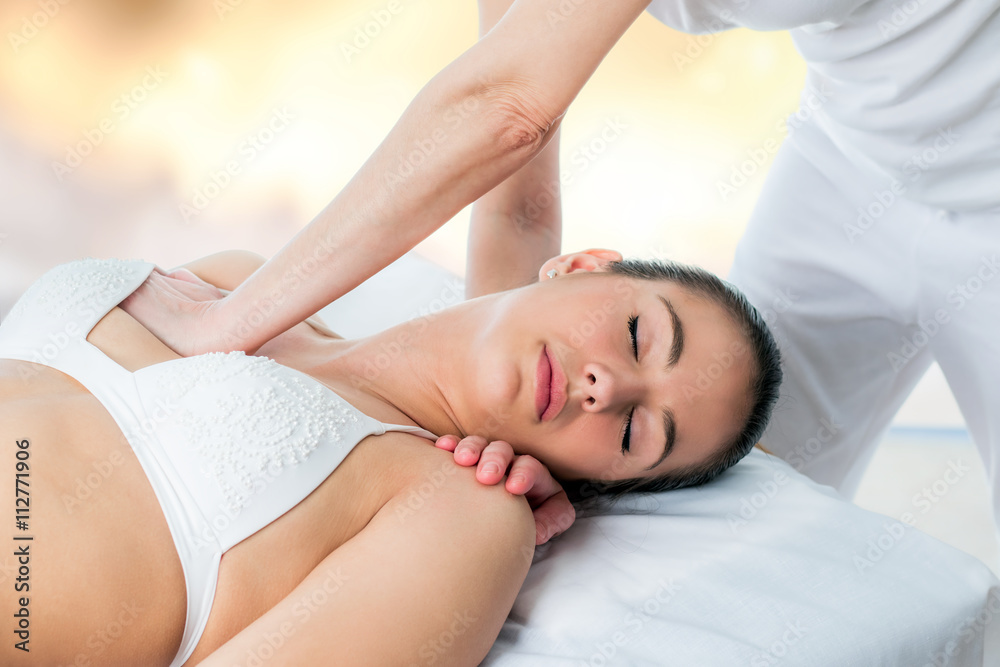 Osteopath applying pressure on female chest. Osteopath applying pressure on female chest.