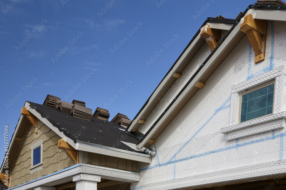 Home building industry gable roof slope transition and stucco ro