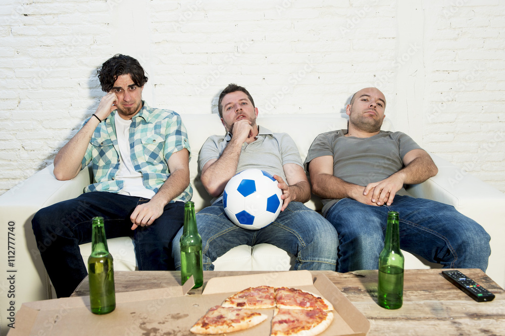 friends fanatic football fans watching tv match with beer bottles and pizza suffering stress