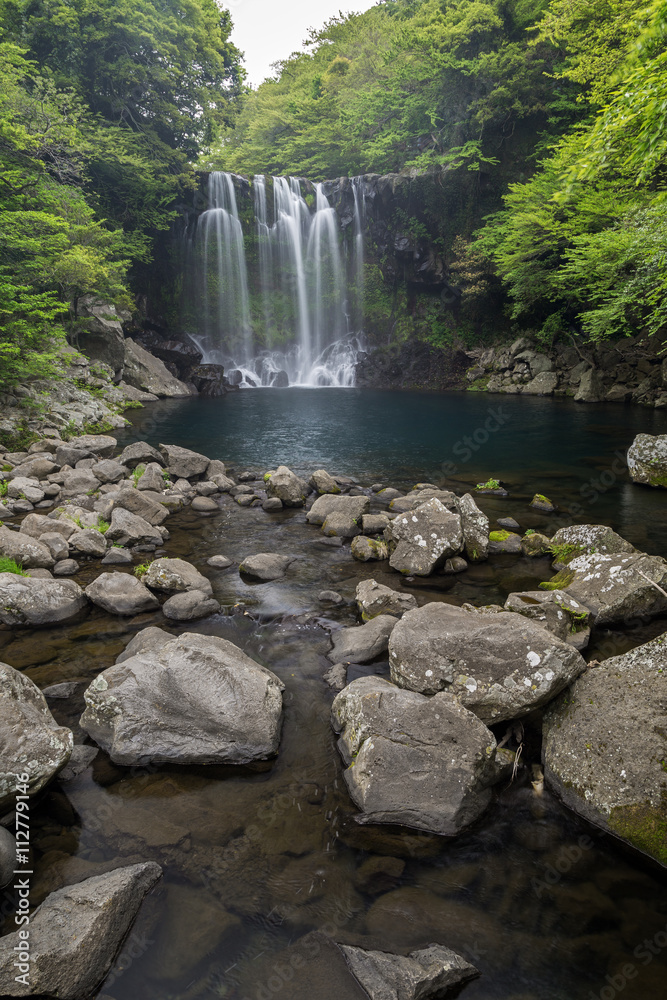 Fototapeta premium Second tier of the Cheonjeyeon Falls on Jeju Island in South Korea.