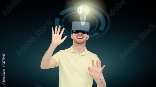 happy man in virtual reality headset or 3d glasses