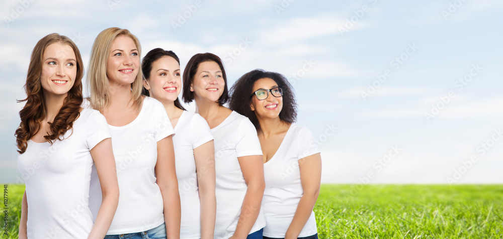 group of happy different women in white t-shirts