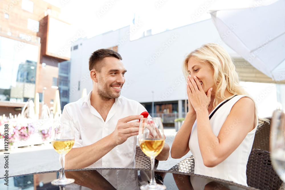 man with engagement ring making proposal to woman man with engagement ring making proposal to woman