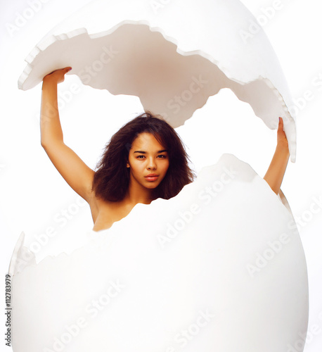 black skined young woman in big crashed egg photo
