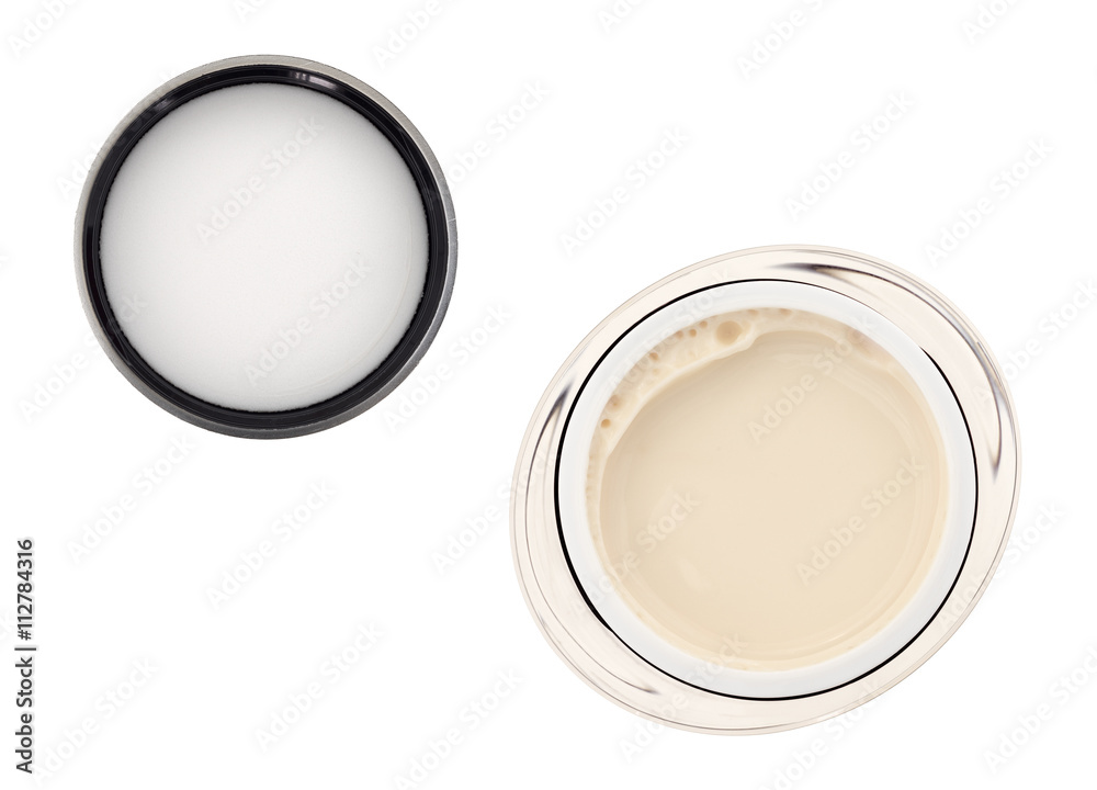 Moisturizing face cream with lid isolated on a white background top view. Moisturizing face cream with lid isolated on a white background top view.