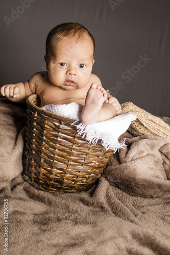Small girl afraid of shooting inside white net fabric