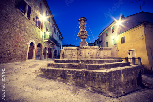 Piazza del Grano with beautiful fountain, Asciano, Tuscany, Italy