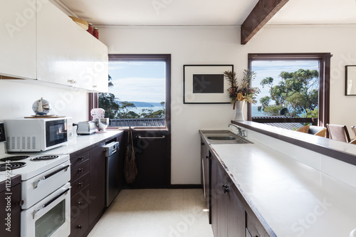 Older style retro 70s kitchen in Australian beach house photo