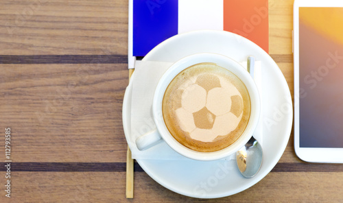 Εκτύπωση καμβά Football, soccer ball latte art, next to smartphone euro 2016 theme