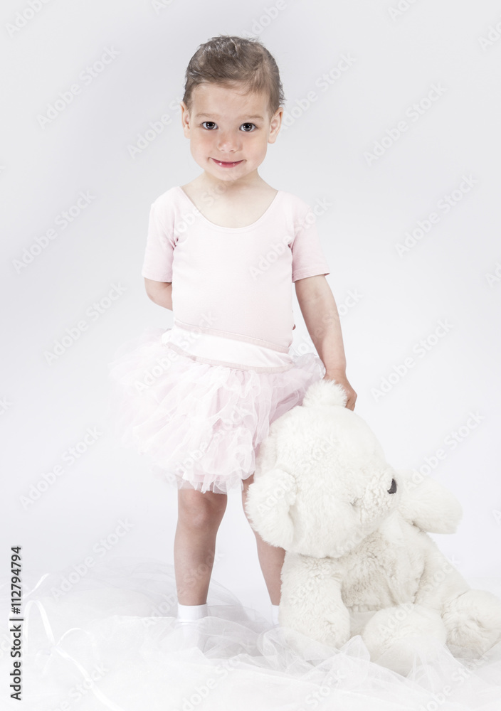 Portrait of Playful Little Caucasian Child. Posing With Big Toy. Portrait of Playful Little Caucasian Child. Posing With Big Toy.