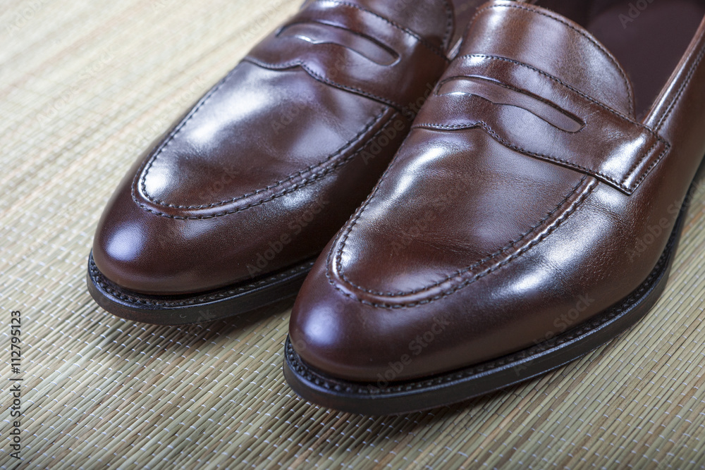 Footwear Concept and Ideas. Men's Stylish Brown Penny Loafers Footwear Concept and Ideas. Men's Stylish Brown Penny Loafers