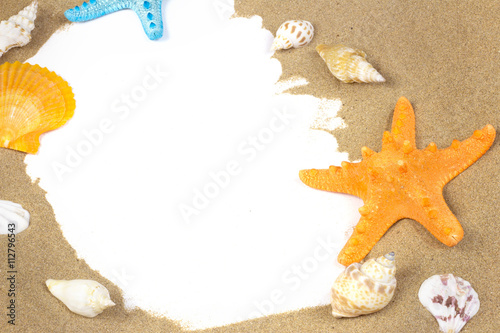 Beach with sand starfish and shells isolated over white