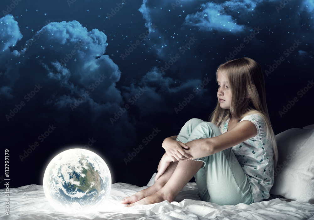 Naklejka premium Girl in her bed and glowing globe