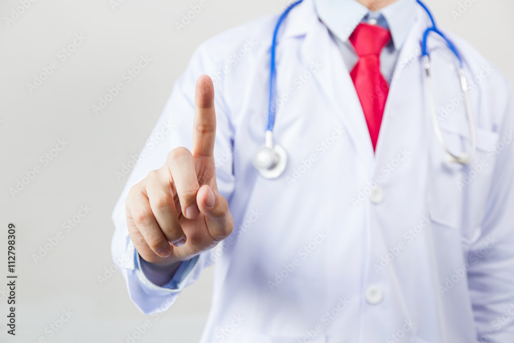 Medical doctor using one finger for pressing virtual touch screen on white isolated background Medical doctor using one finger for pressing virtual touch screen on white isolated background