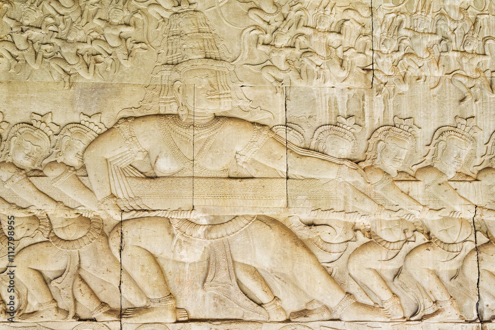 Famous bas relief carving The Churning of the Sea of Milk at Angkor Wat temple, Siem Reap, Cambodia.
