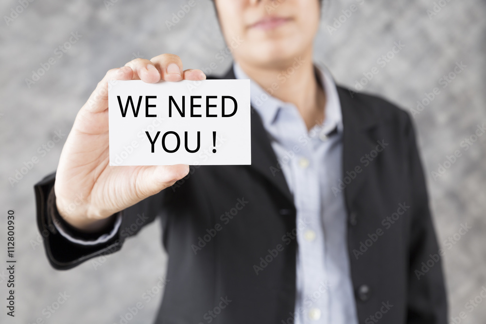 businessman presenting business card with word we need you businessman presenting business card with word we need you